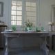 Console, solid walnut table, foldable extensions, grey patinated legs.