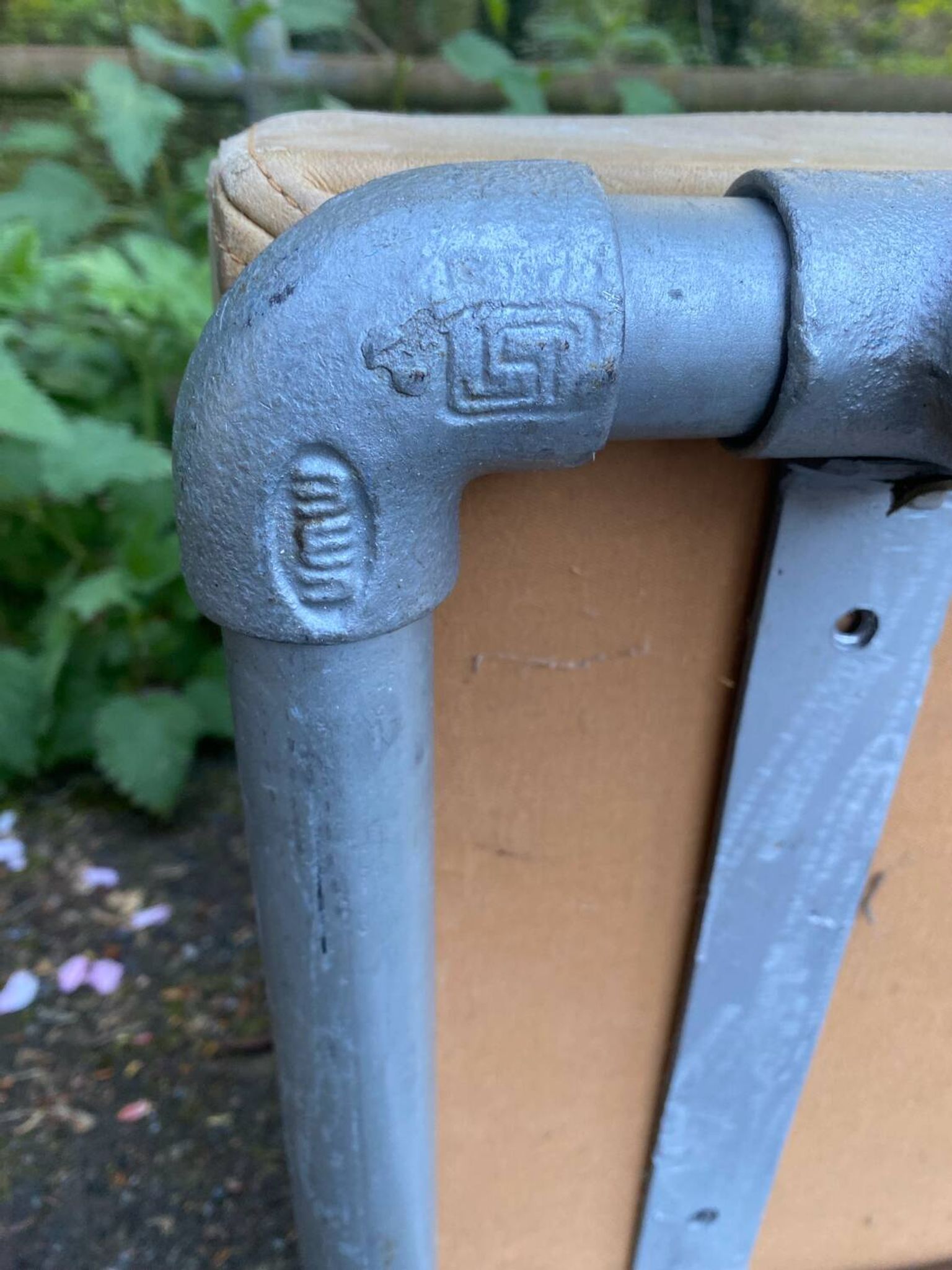 Vintage Italian industrial bench in leather and metal.