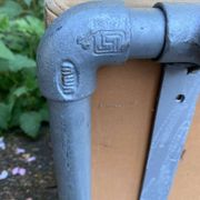 Vintage Italian industrial bench in leather and metal.