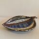 Danish ceramic dish shaped like a leaf.