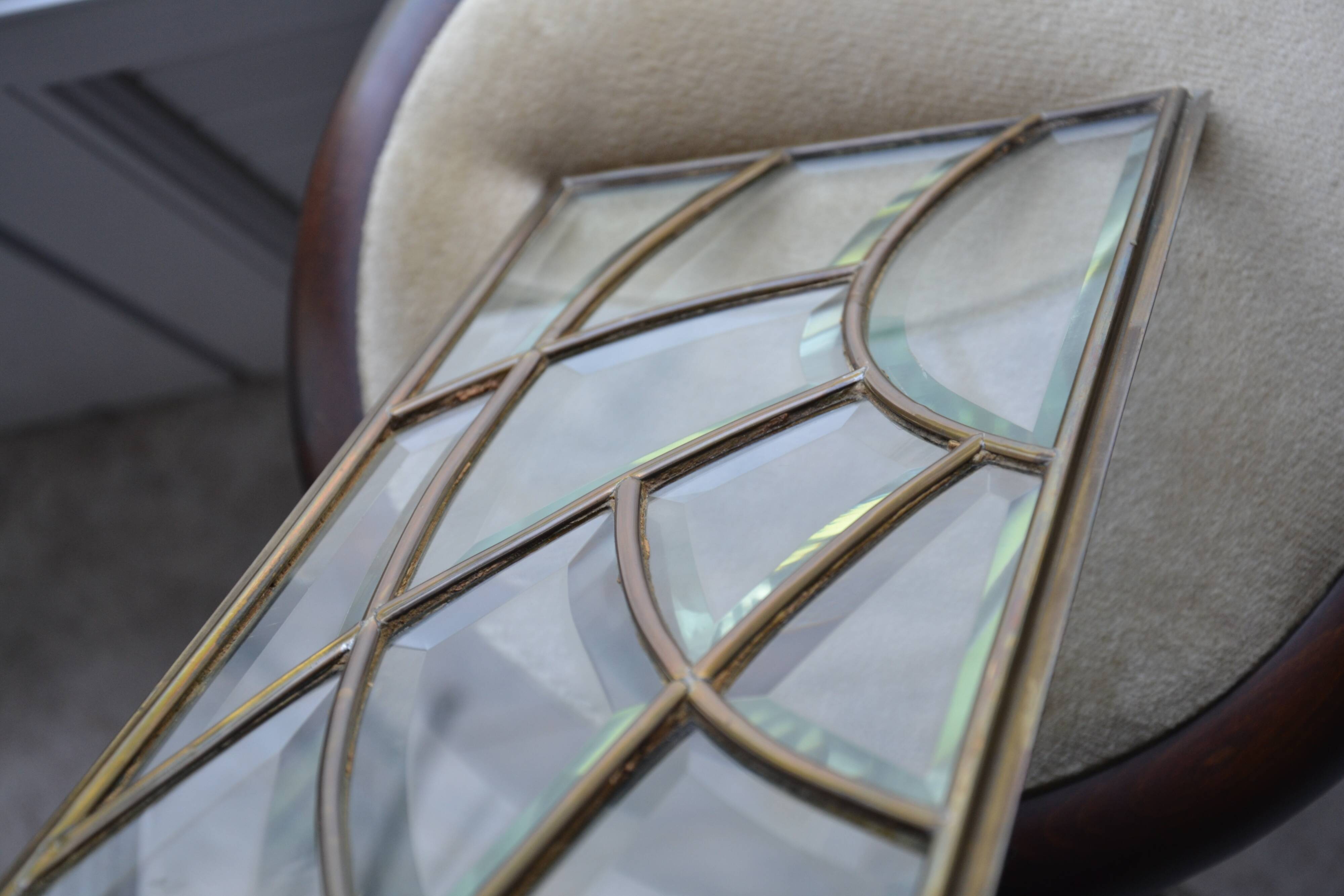 Deux vitraux en verre biseauté et laiton