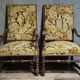 Pair of antique carved wooden armchairs – Figurative upholstery