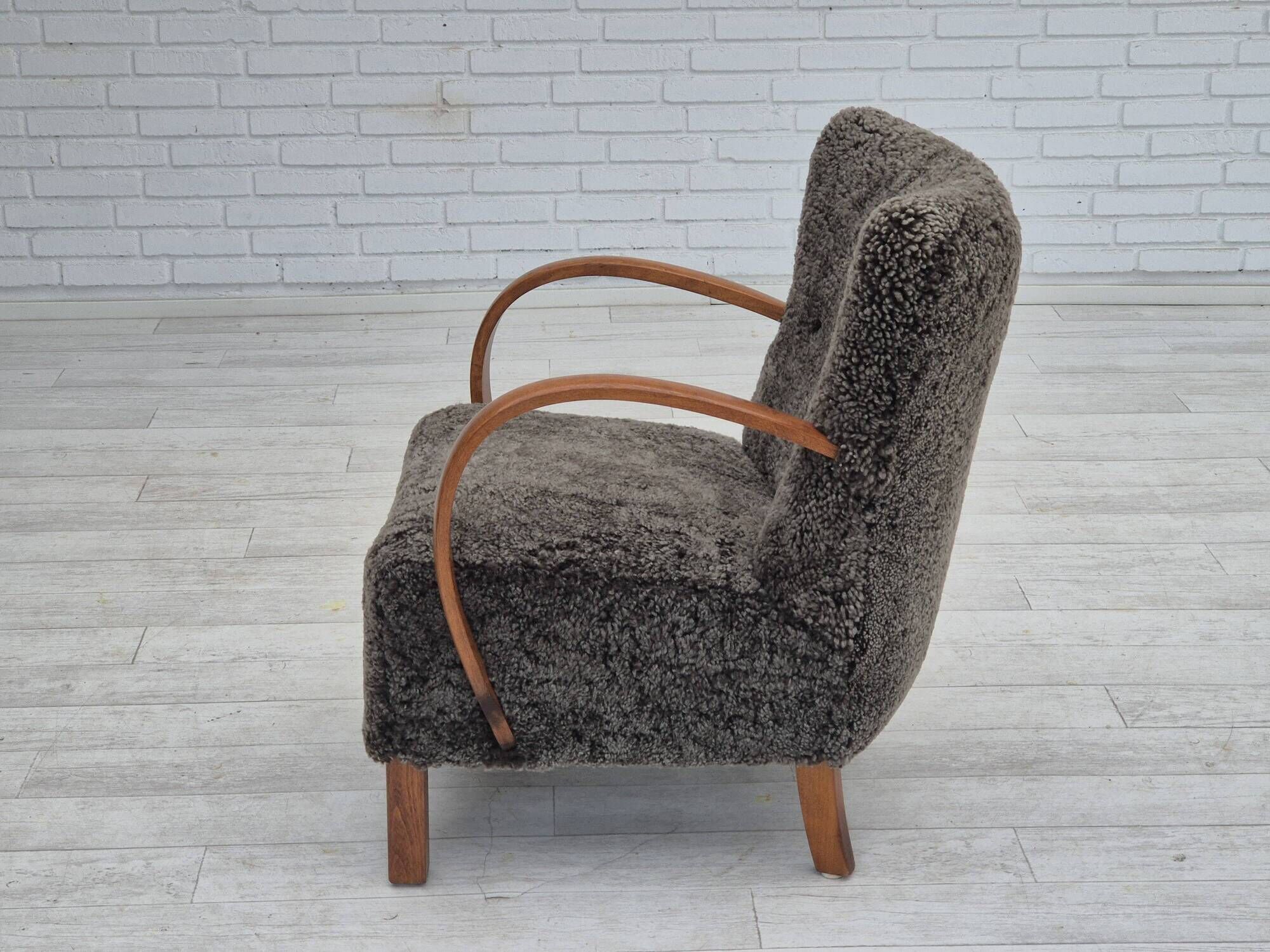 1960s, completely reupholstered Danish art deco armchair, genuine sheepskin "Wellington".