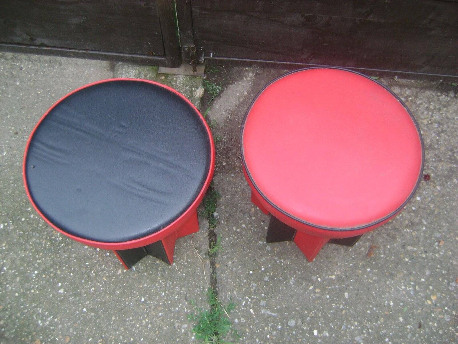 Set of mid-century black and red fabric stools, 1950s star base.