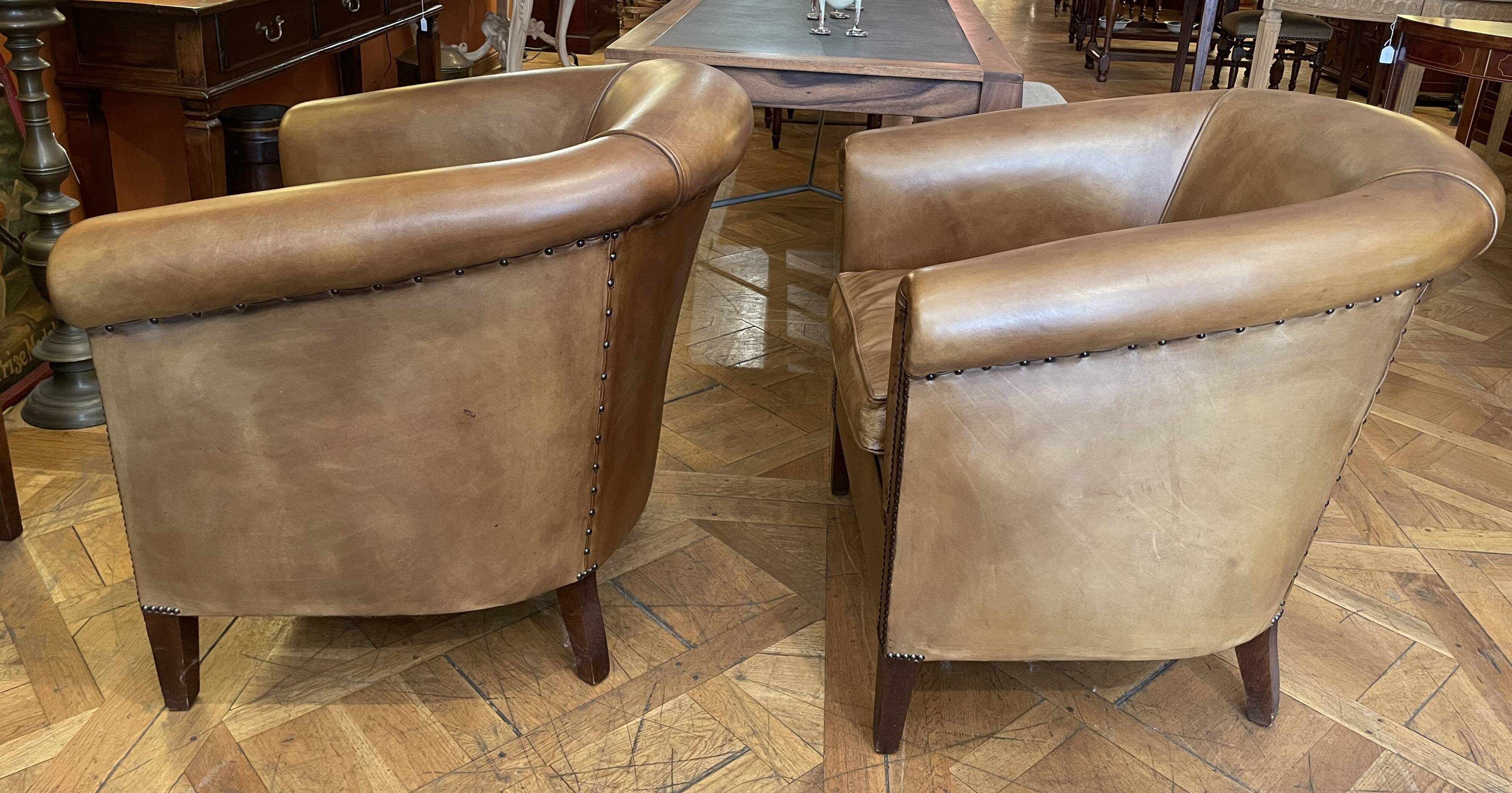 pair of camel leather club armchairs