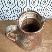 Sandstone pitcher signed Jeanne and Norbert Pierlot