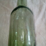 Set of three old bottles of green moulded glass
