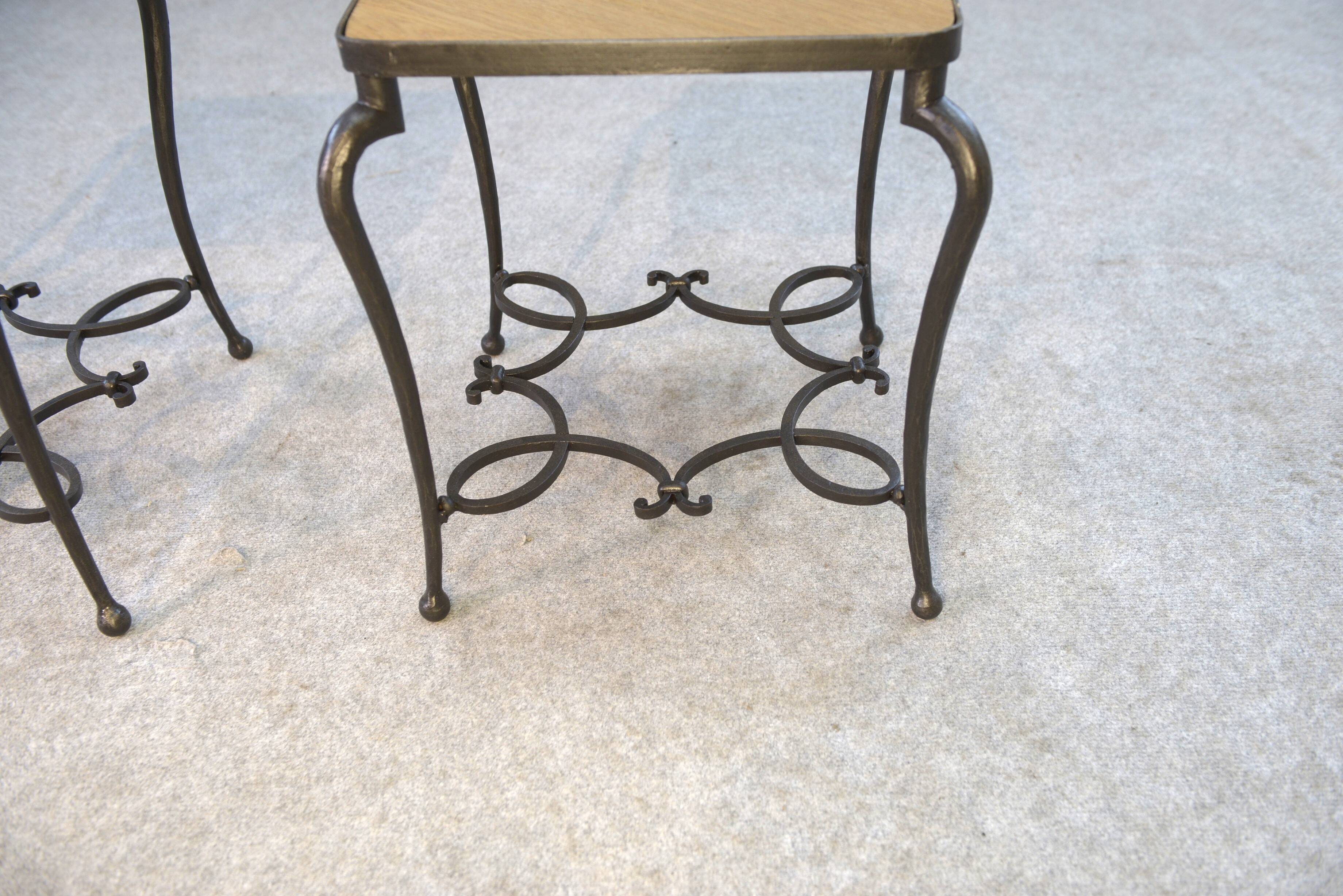 Pair of wrought iron side tables with oak tops, French work