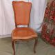 Caned chair in Louis XV style painted orange.