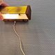 Fuga wall lamp in solid brass and teak wood was designed by Jo Hammerborg for Fog & Mørup in 1966.