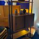 Italian footcase bookcase from the 60s in teak and metal
