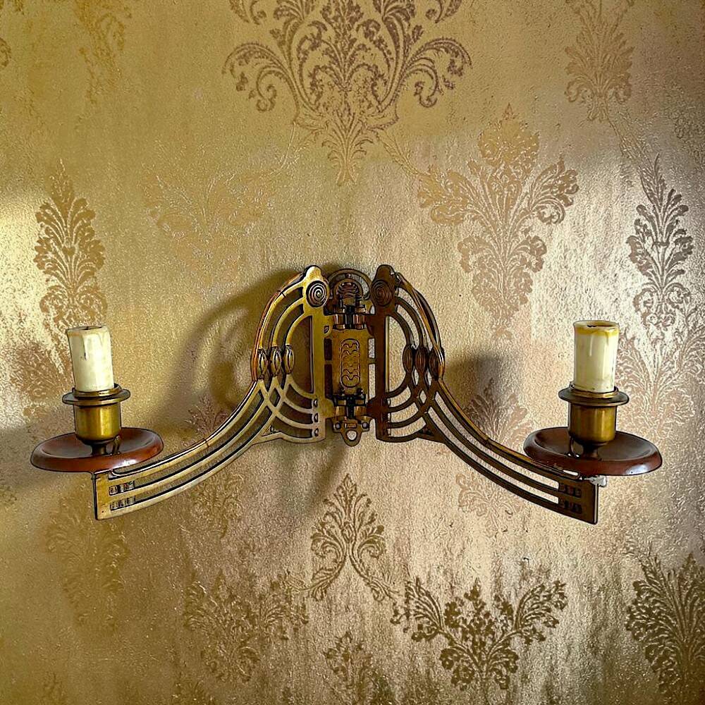 Art Nouveau style brass double piano wall lamp
