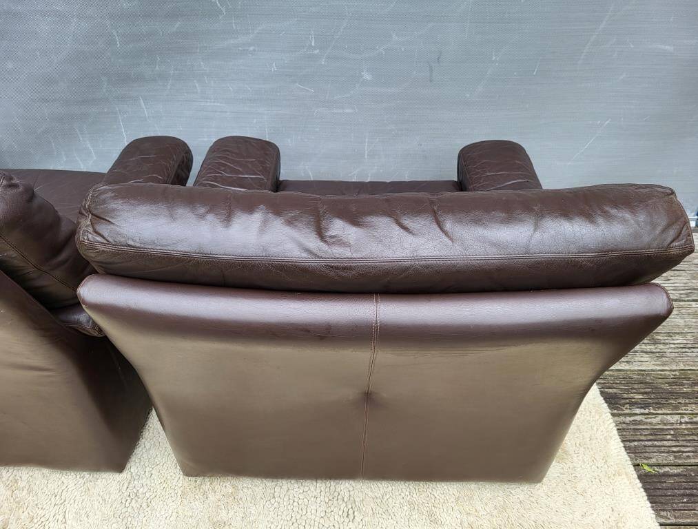 Pair of chocolate leather lounge chairs