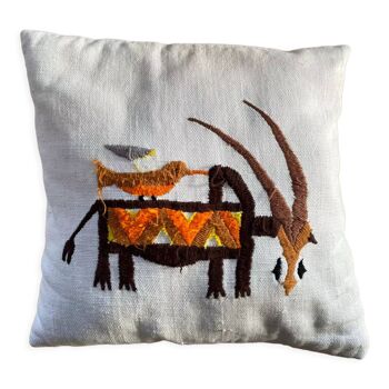 Vintage wool cushion with hand-sewn animals