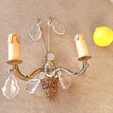 Gold wall light with tassel