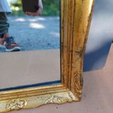 narrow gilded mirror in Louis XV style