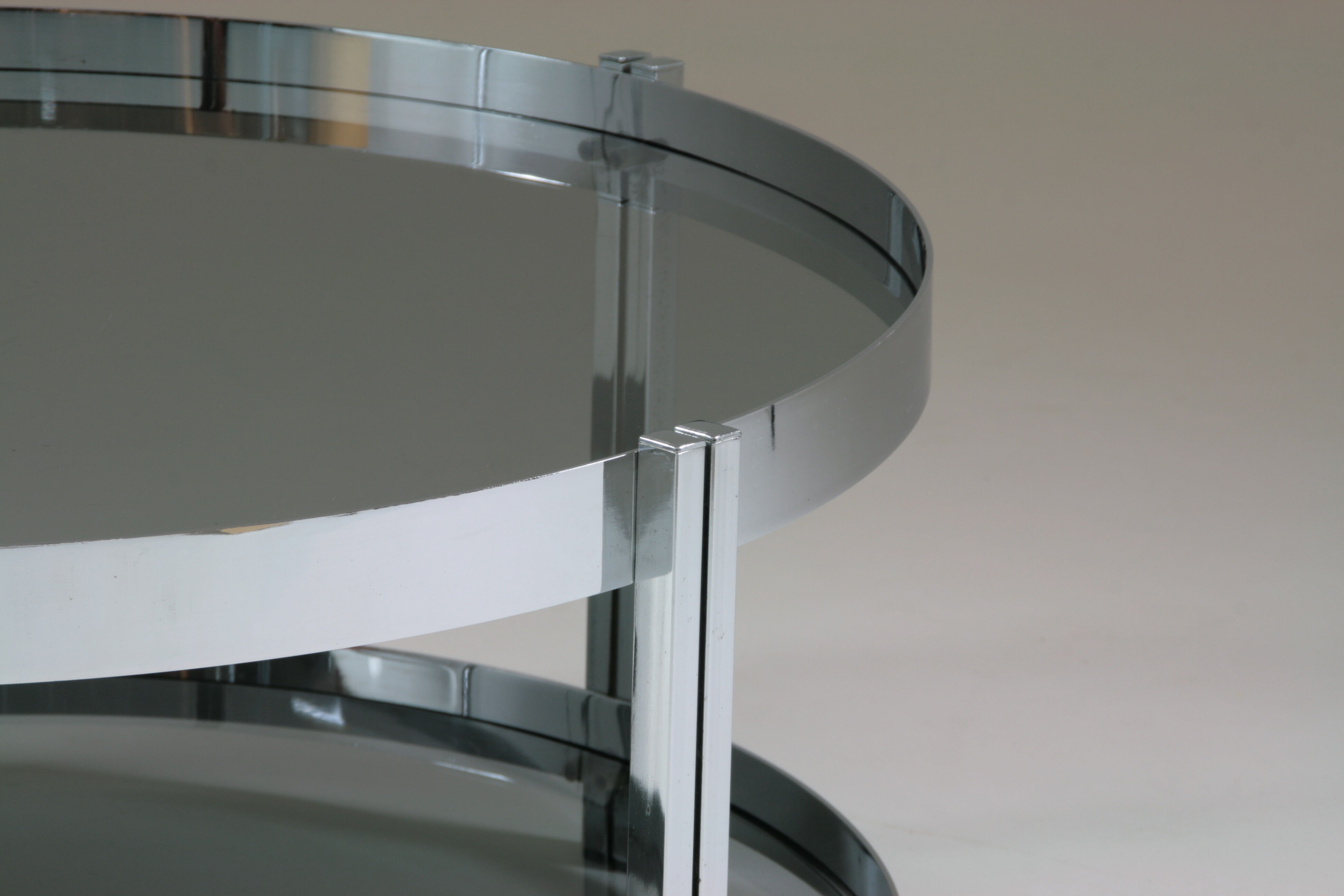 Round chrome-plated metal coffee table and smoked glass tops, France 1970s