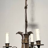 Empire-style bronze chandelier with 3 arms of light topped with eagle heads. French work. Circa 1900.