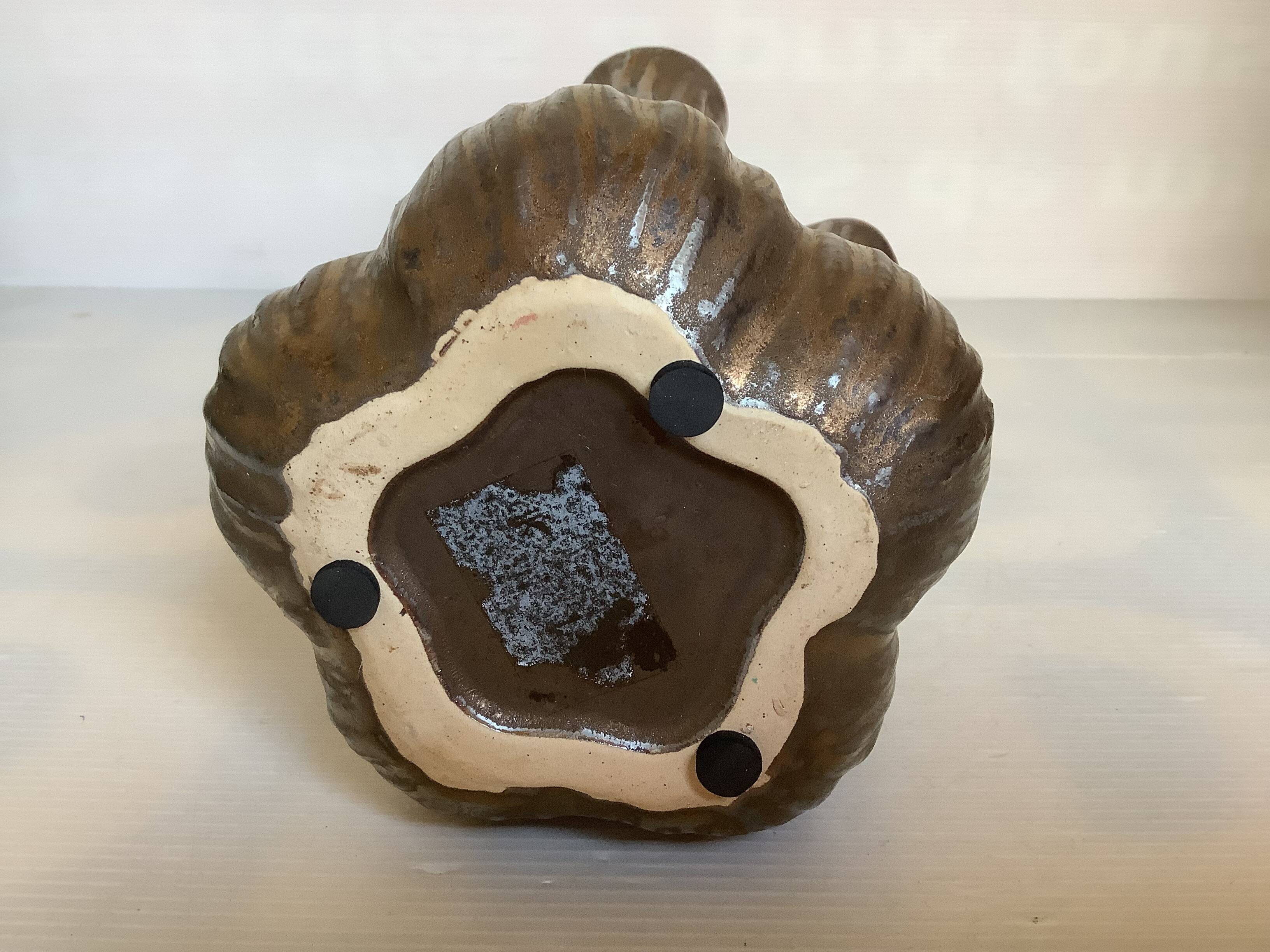 Tulip vase with ceramic flowers in brown and gold.
