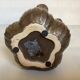 Tulip vase with ceramic flowers in brown and gold.
