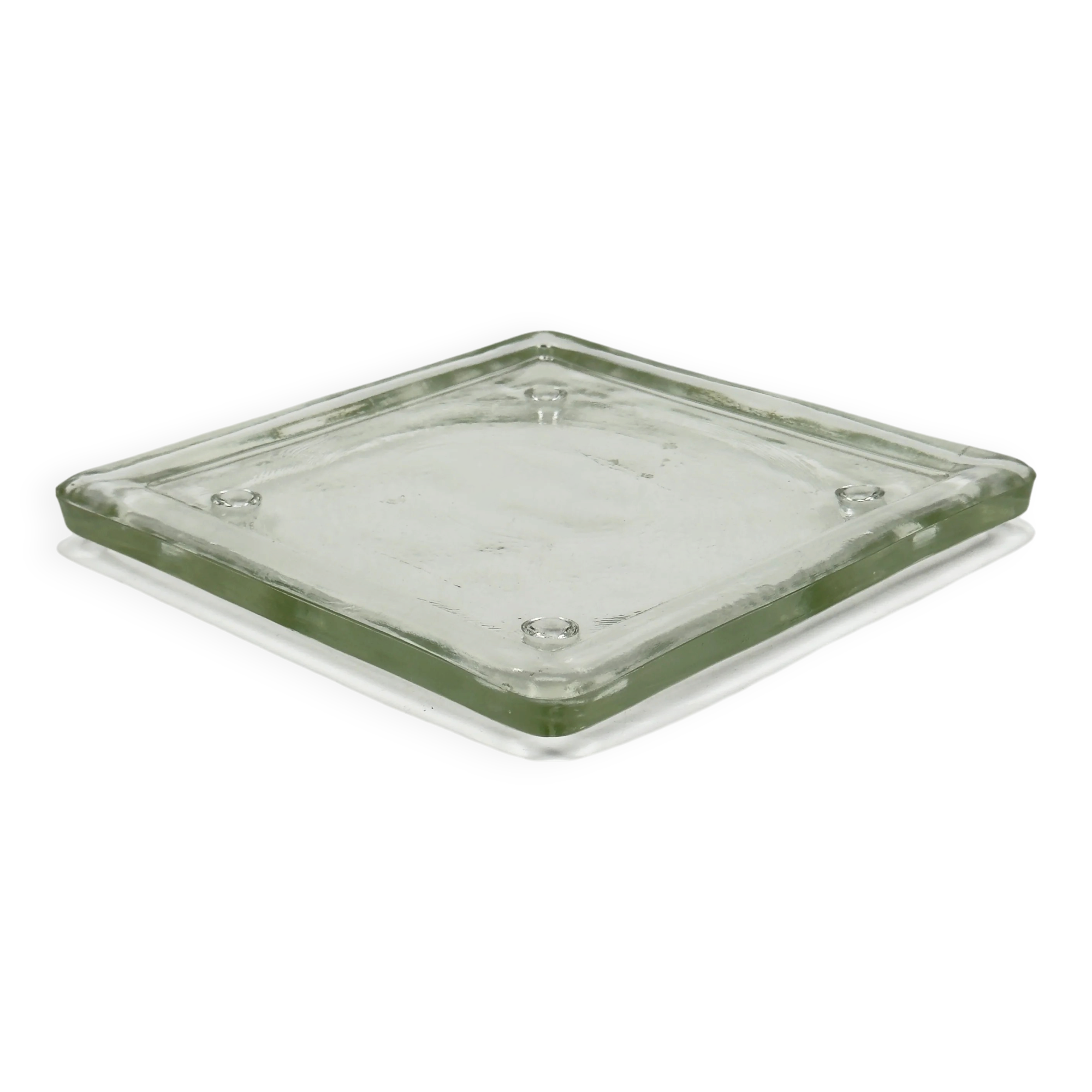 Vintage square serving tray in pale green tinted transparent glass with raised feet.