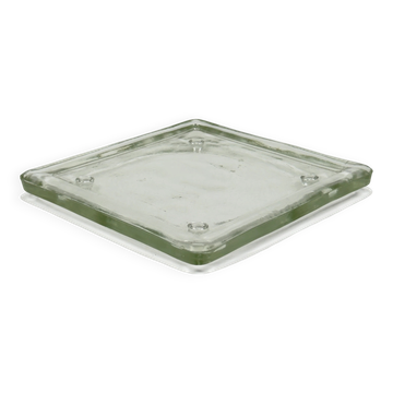 Vintage square serving tray in pale green tinted transparent glass with raised feet.