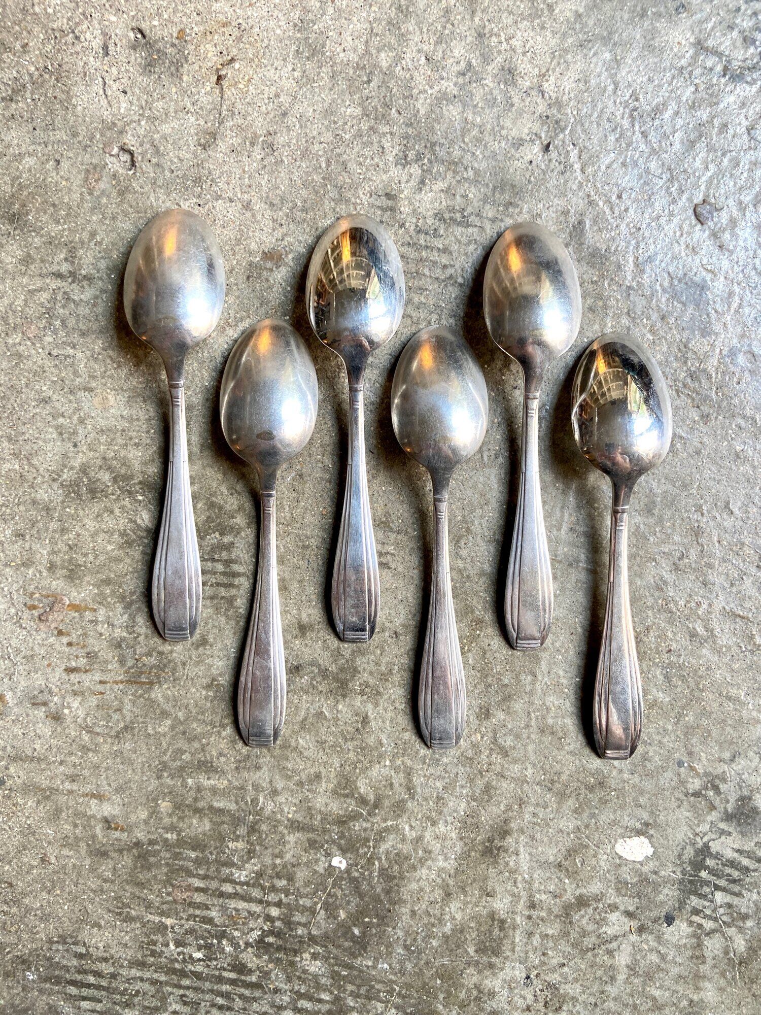 6 silver metal spoons