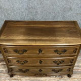 Curved Louis XV style chest of drawers in solid wood with light patina