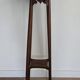 High plant stand in carved wood and Art Nouveau marble.
