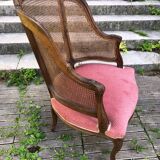 Louis XV style walnut and cane armchair