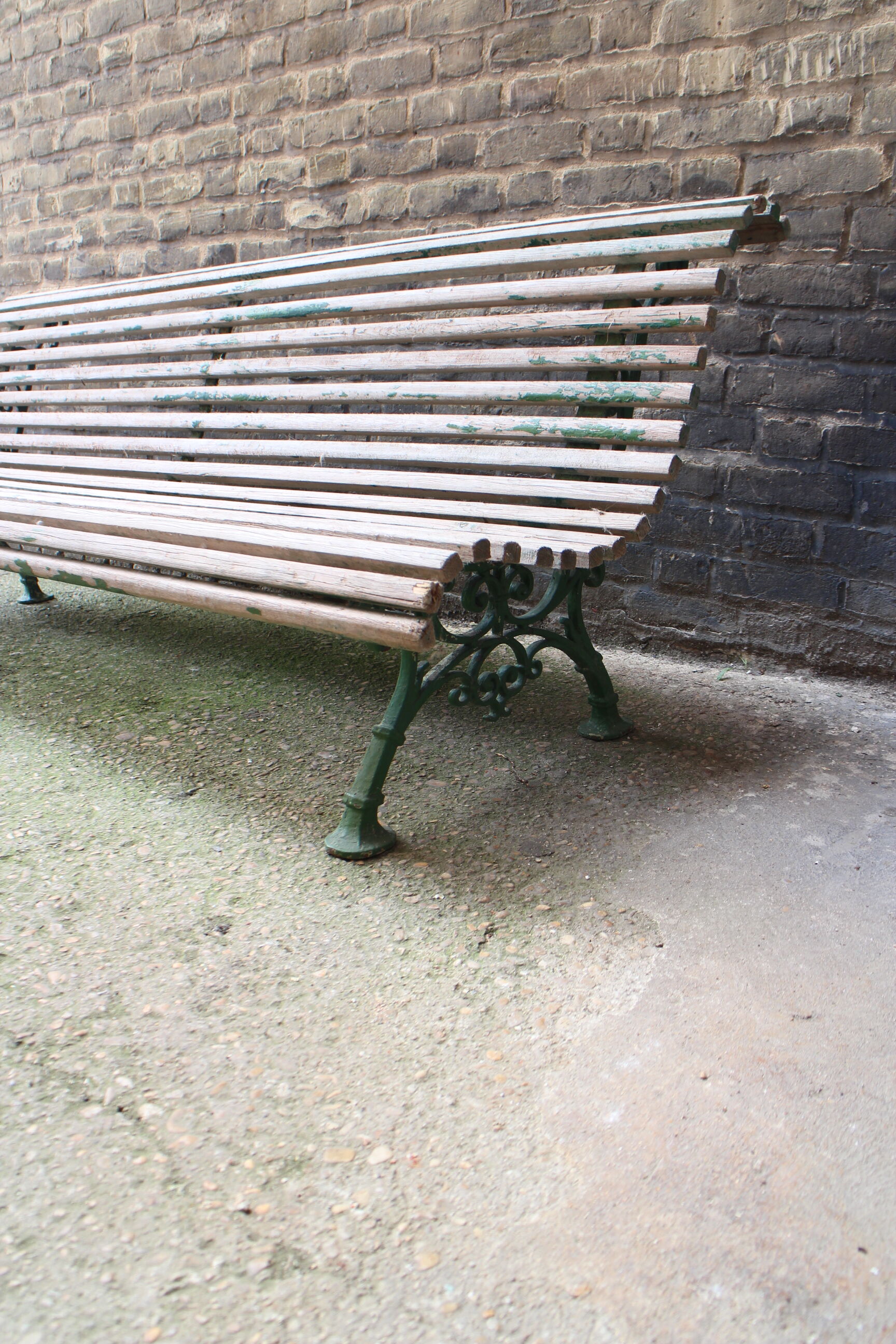 Old bench cast iron base and wooden slats