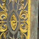 Rectangular Indonesian construction element with blue and yellow plant in carved wood