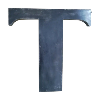 Letter t in metal