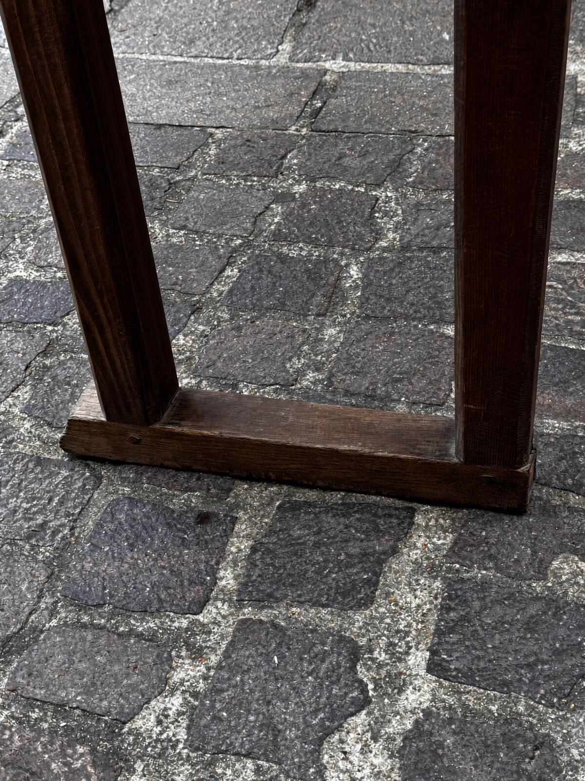 Old wooden bench with backrest and armrests