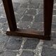 Old wooden bench with backrest and armrests