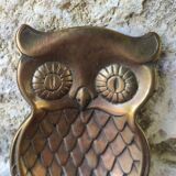 empty brass owl pocket