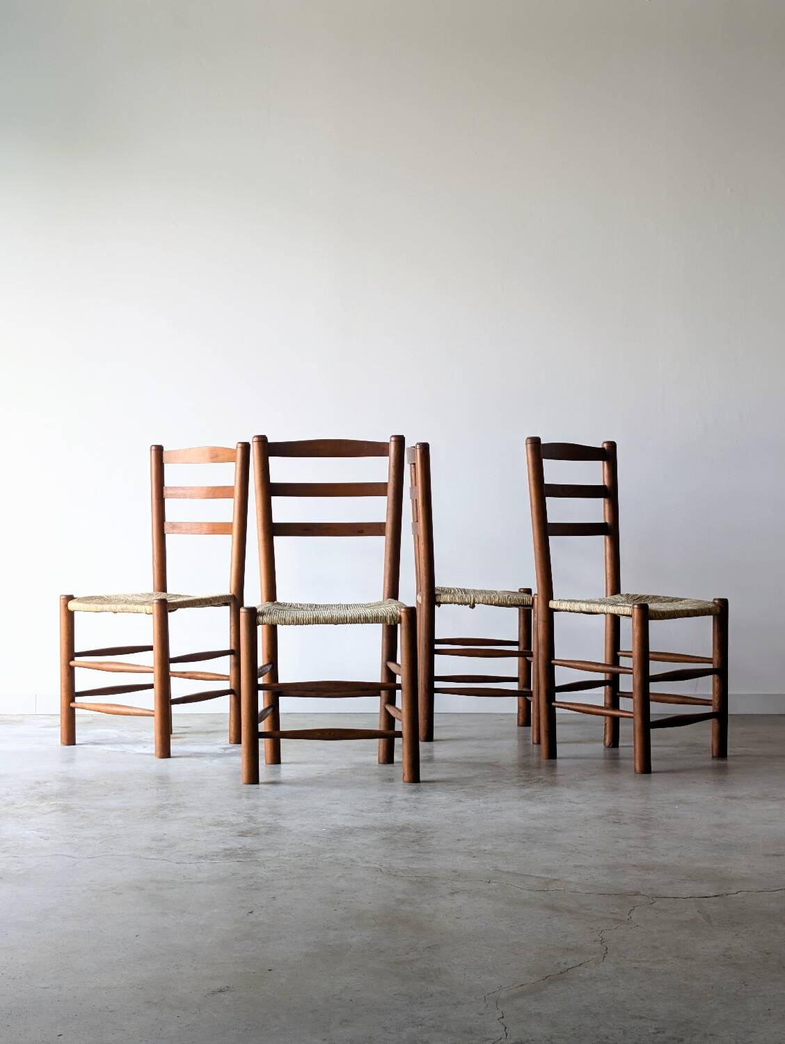 4 vintage brutalist chairs in the style of Perriand, 1960s 1970s.