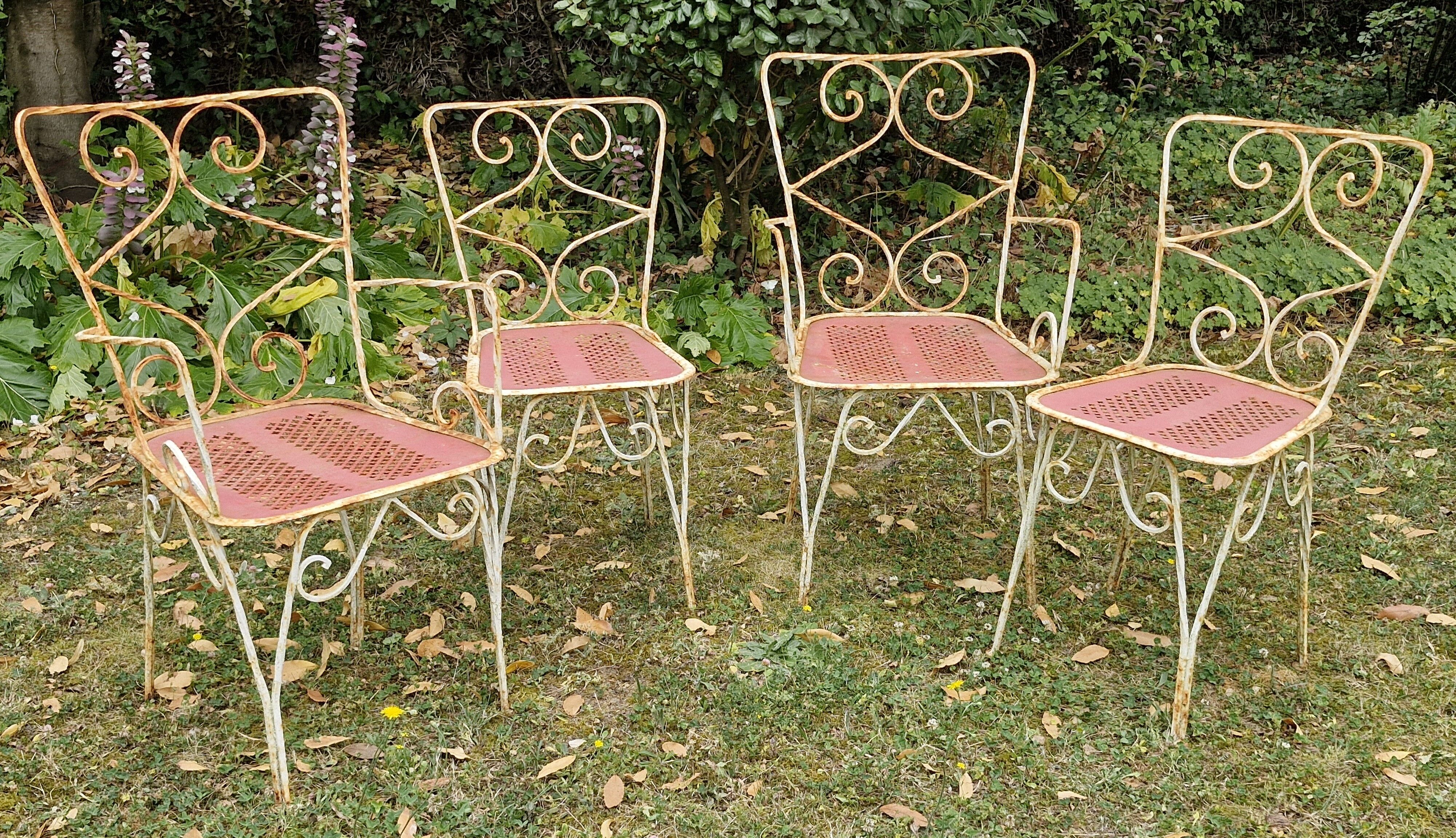 Perforated metal garden chairs and armchairs