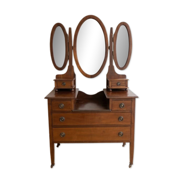Antique wooden dressing table with a triptych mirror.