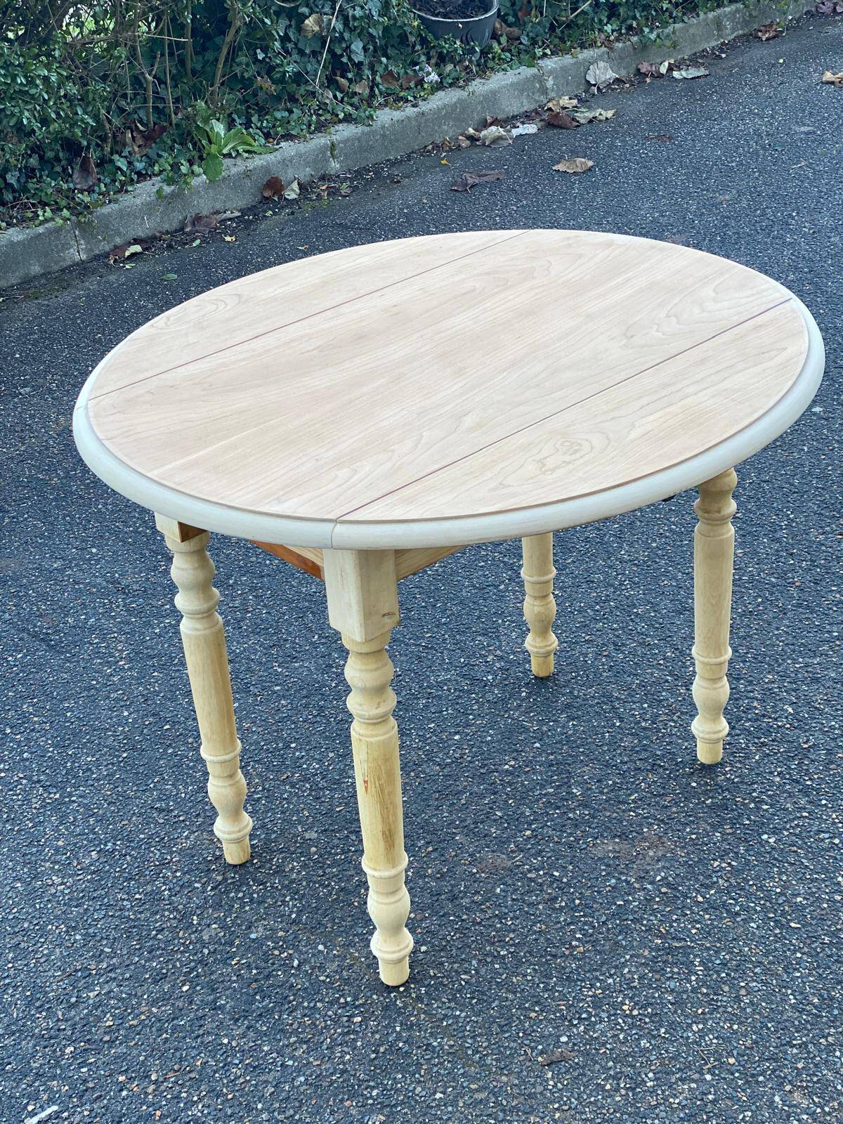Round table with flaps or shutters renovated in raw solid wood