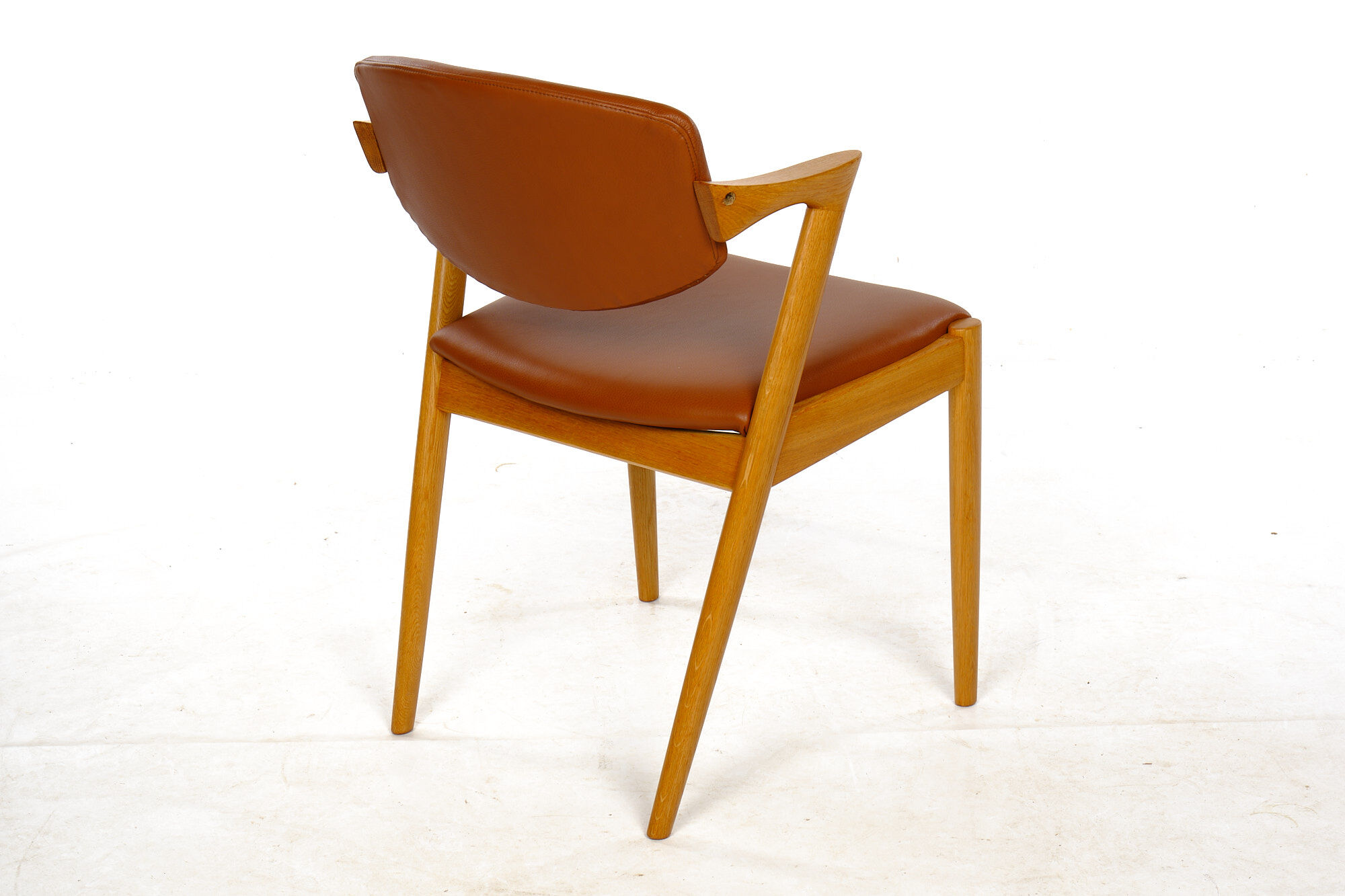 Four Kai Kristiansen oak chairs with new leather upholstery