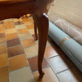 Round extendable wooden table with glass top