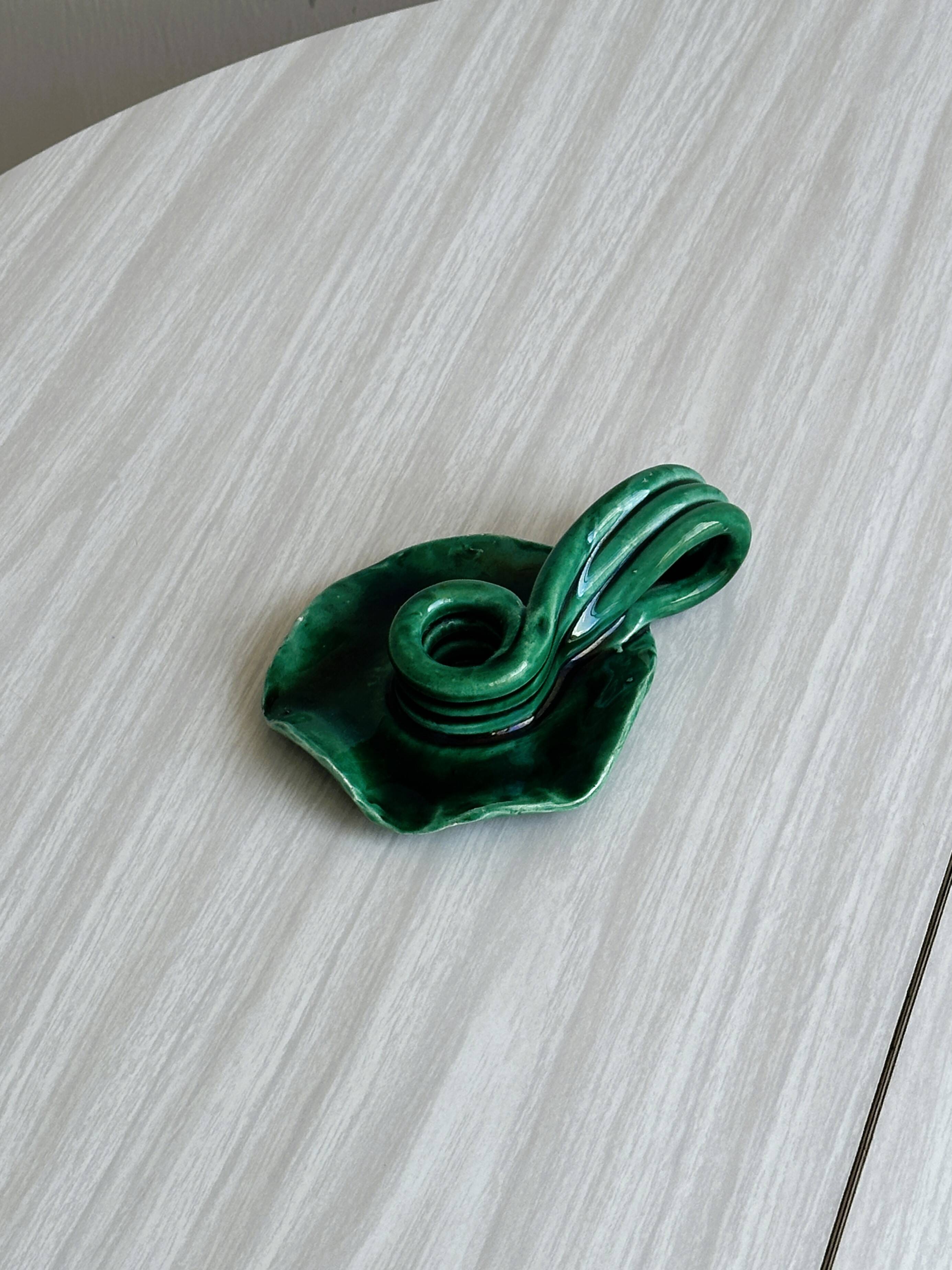 Vintage green glazed ceramic candle holder, organic design.