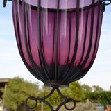 Large blown glass and wrought iron vase on shower stand