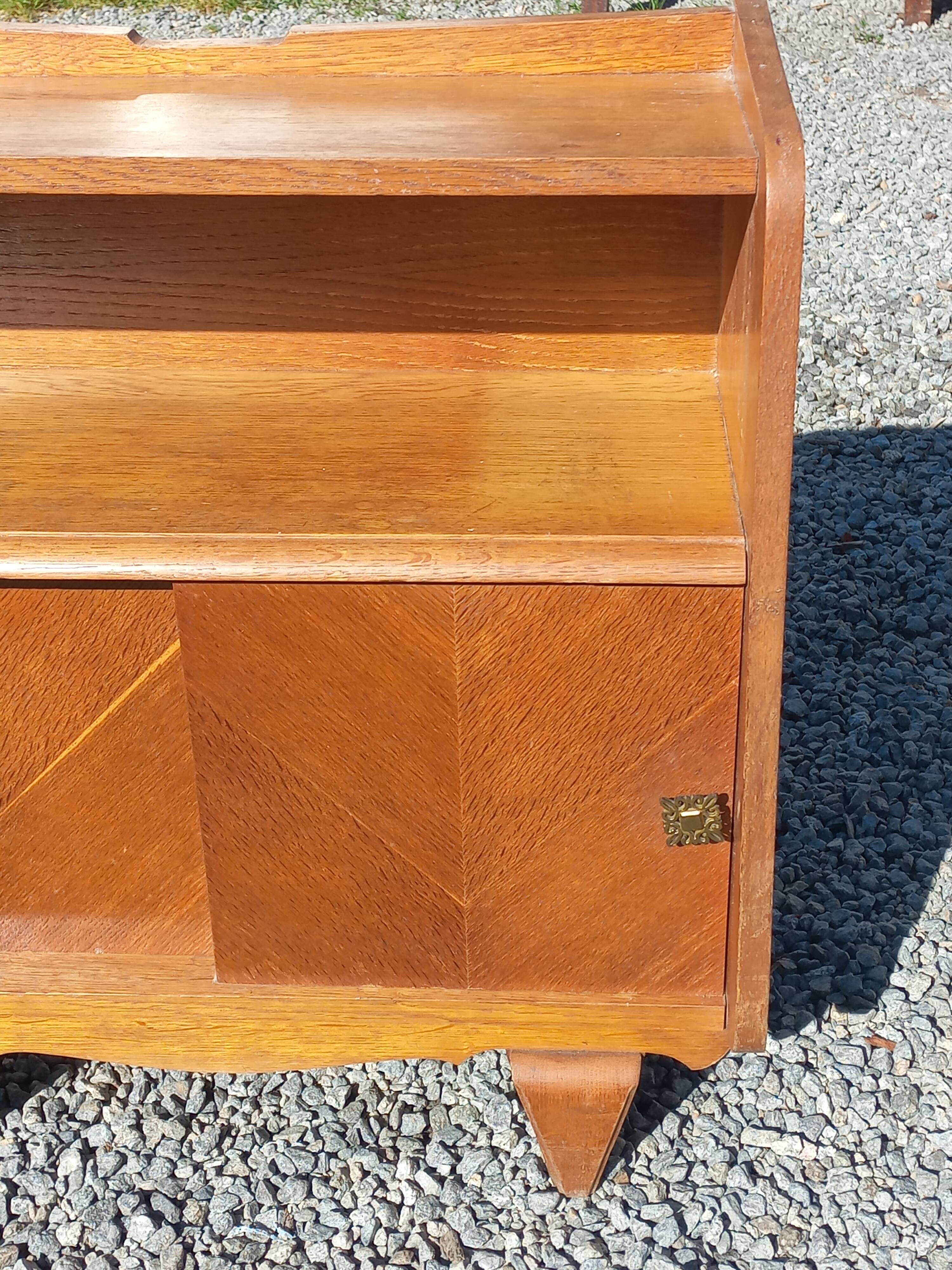 Vintage accent furniture in golden blonde oak with 2 sliding doors.