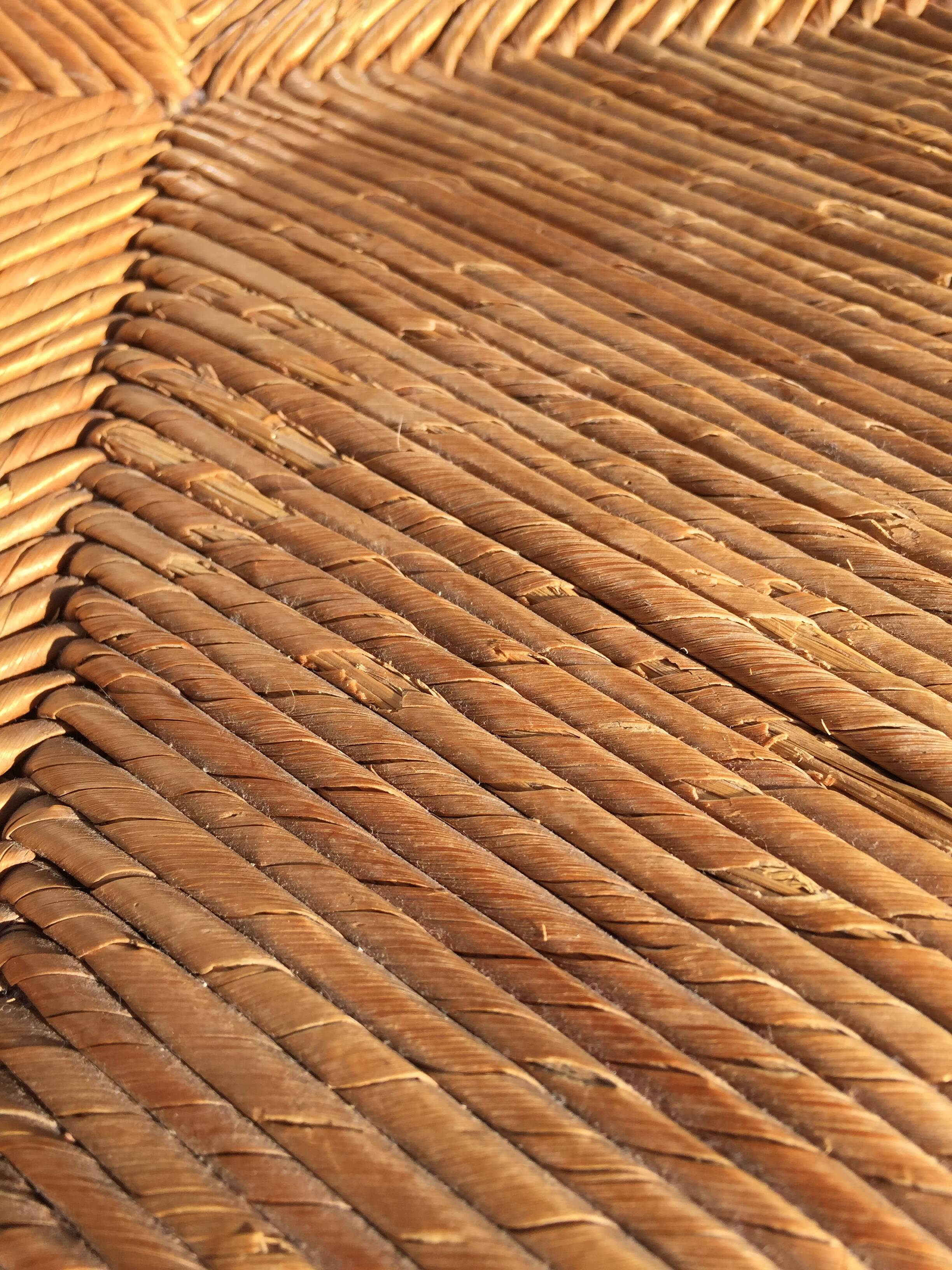 Straw low chair in the style of Charles Dudouyt