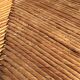 Straw low chair in the style of Charles Dudouyt