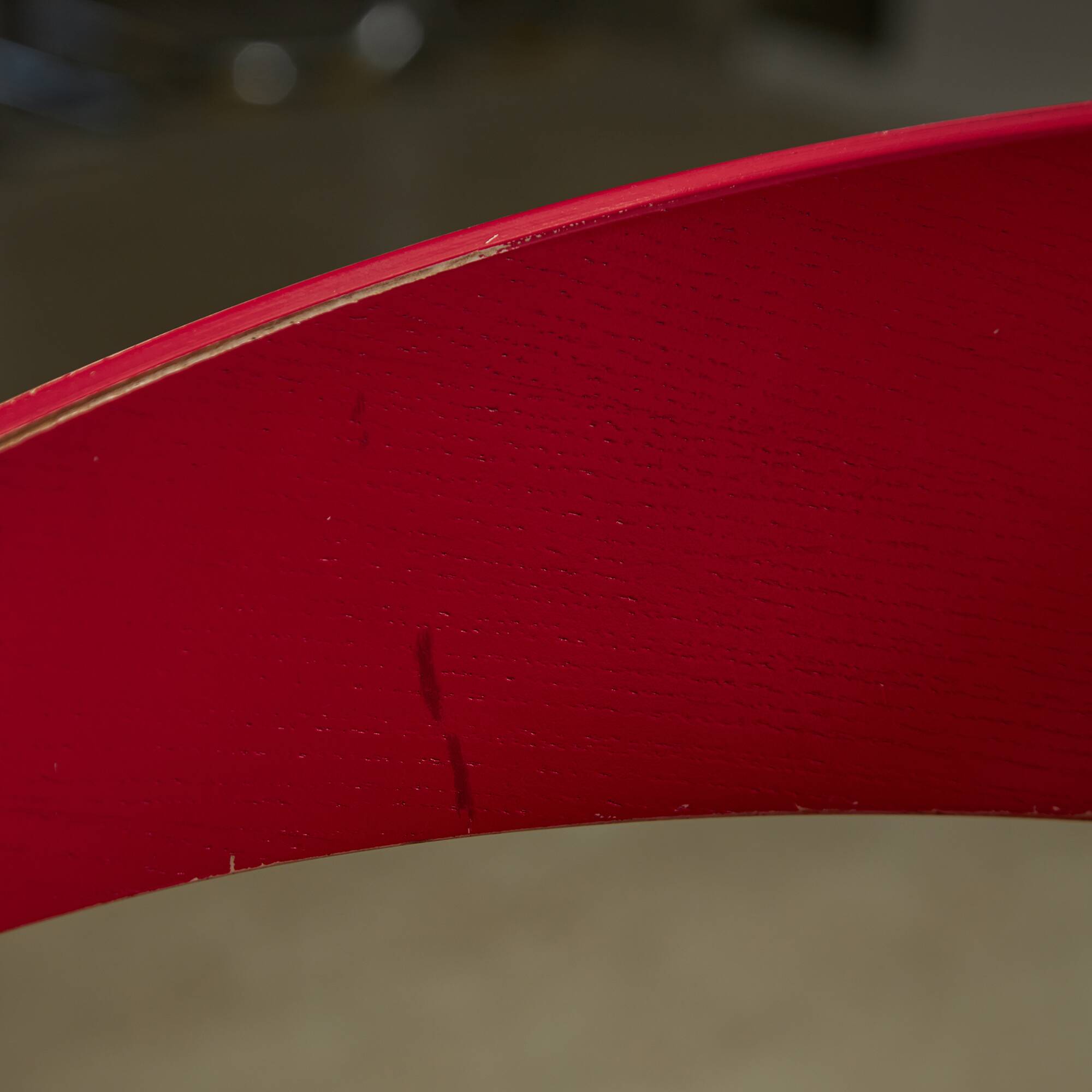 Red Plywood and Curved Metal Frame Chair