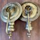 Pair of vintage wall sconces in textured brass, brutalist style.