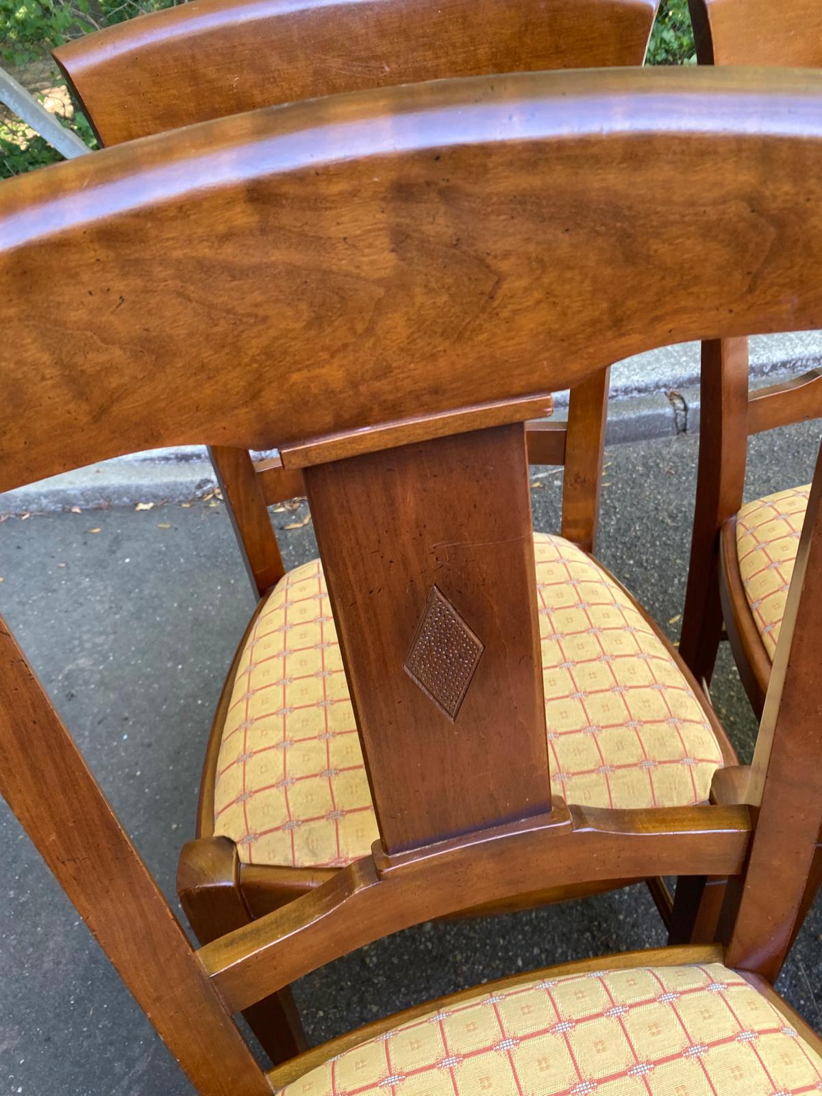 6 Syriel solid cherry wood dining chairs with yellow fabric.